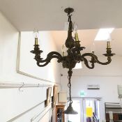 An early 20thc brass ceiling pendant with six radiating branches and acorn pendant (47cm x 60cm)