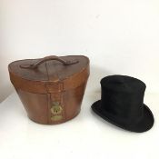 An early 20thc beaver fur top hat, inner lining inscribed L. Gray, (aperture: 20cm x 16cm) and a