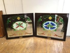 A pair of mahogany framed pub mirrors, both with reverse painted stylised daffodils around a central