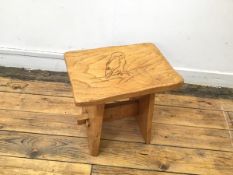 A rustic stool, the rectangular top with owl decoration, with undulating side, on splay supports