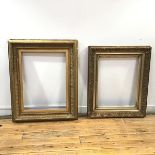 Two 19thc partial gilt and gesso picture frames, one decorated with foliate scrolls, the other