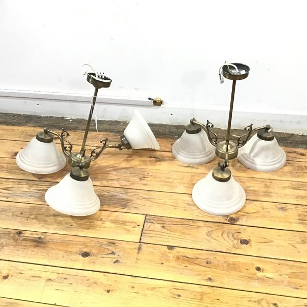 A pair of three arm hanging lights with adjustable opaque glass shades (39cm x 39cm)