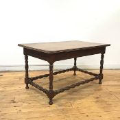 An unusual solid walnut occasional table, early 20thc., the rectangular top with moulded edge and