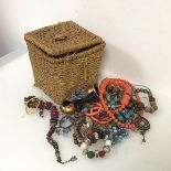 An assortment of costume jewellery including paste and wooden bead necklaces, bangles, bracelets,
