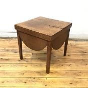 A 19thc oak occasional table, formerly a commode, the oblong top with lunette shaped apron and