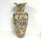 A 1920s Japanese Satsuma vase of baluster form, the undulating flared lip (some repairs), with