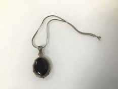 An onyx oval pendant in silver mount on a silver snake link chain (25cm) (29.43g)