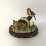 A Border Fine Arts resin figure entitled The Joys of Spring (14cm x 17cm x 13cm), on mahogany stand