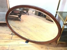 An Edwardian mahogany oval inlaid wall mirror with bevelled glass plate (59cm x 90cm)