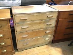 A 1950s oak Utility chest, the rectangular top fitted four graduated long drawers, on square feet (