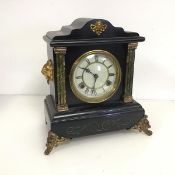 A 19thc mantel clock resembling a slate clock but of wooden construction, the dial inscribed