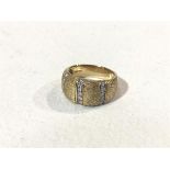 A 14ct gold hatched bombe style ring with three rows of brilliant cut diamonds (10g) (S)