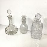 Three glass decanters of various shapes and cuts, all with stoppers (two a/f) (tallest: 28cm x d.