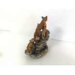 A Border Fine Arts figure of a Vixen with four Cubs, on a Rocky Outcrop, dated 1990, no.1420/1500