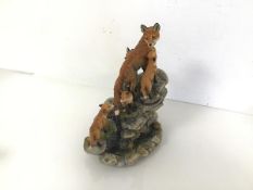 A Border Fine Arts figure of a Vixen with four Cubs, on a Rocky Outcrop, dated 1990, no.1420/1500