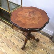 An early 20thc. mahogany topped occasional table, (losses), the moulded scalloped edge above a plain