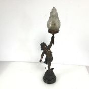 A spelter table lamp in the form of Aros, holding a Torch, the opaque glass shade in the form of