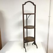An Edwardian mahogany folding cake stand, lacking one support (93cm x d.24cm)