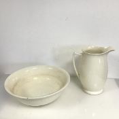 An early 20thc creamware wash basin and ewer (ewer: 26cm x 24cm x 15cm)