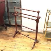 A Victorian mahogany four bar towel rail, raised on carved tapered column twin end supports (89cm
