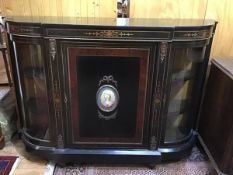 A Victorian ebonised breakfront credenza with inlaid boxwood and burr elm roundels, with ormolu