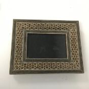 An Iranian inlaid picture frame with glass and support to reverse (internal: 7cm x 11cm)