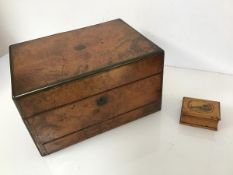 A 19thc. walnut toilet box, the hinged top opening to a fitted interior (a/f), with five jars and