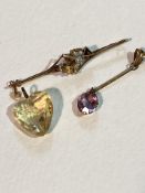 A faceted citrine heart shaped pendant (1.5cm x 2cm), a 9ct gold bar brooch with stylised thistle