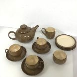 A Denby teaset comprising a teapot (14cm x 27cm x 18cm), three teacups and saucers, sugar bowl, milk