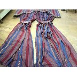 A large pair of interlined curtains in a striped fabric, shades of blue, red and yellow, with