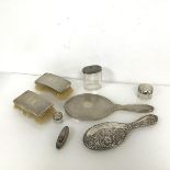 A selection of dressing table items including two engine turned brushes and mirror (30cm x 12cm),