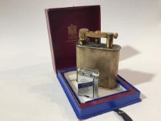 A chromium plated Scottish Rally 1954 commemorative lighter (h.5cm) and a Alfred Dunhill Ltd