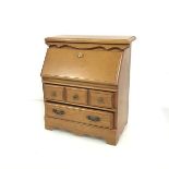 A novelty jewellery box in the form of a bureau, with a fall front above two long drawers (29cm x