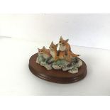 A Border Fine Arts resin figure of Three Foxes, dated 1982 no. 1040/1500, on mahogany stand (10cm