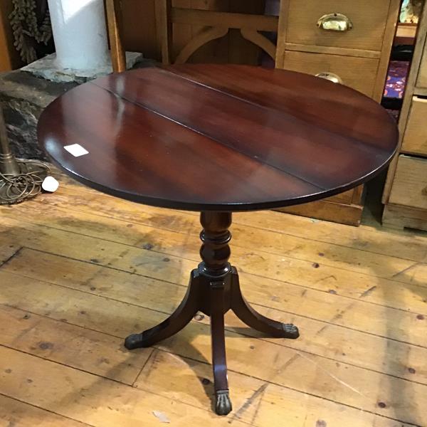 A reproduction drop leaf mahogany pedestal table, on turned column and bipod support (56cm x d.