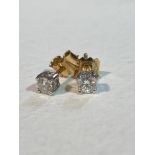A pair of diamond stud earrings (0.2ct each), on 9ct gold mounts in claw setting (1.09g) (l.1.5cm)