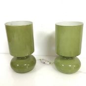 A pair of 1970s style moulded cased glass table lamps manufactured in one piece in a spinach