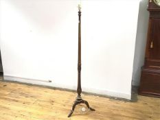 A 1920s floor lamp with turned body ending in a gadrooned knop, on tripod base (152cm x 40cm)