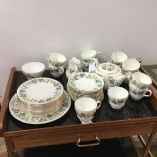 A Wedgwood teaset, with leaf and fruit decoration, including twelve teacups, twelve saucers, teapot,