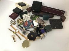 A mixed lot including an assortment of jewellery boxes, compacts, wristwatches, rings, keys, coins