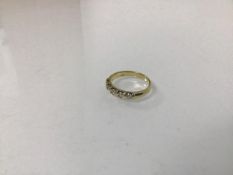 An 18ct gold five stone diamond ring (O) (3.82g)