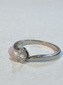 A platinum solitaire ring set with a pear shaped diamond (approx. 0.38ct) (T/U) (4.44g)