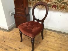 A Victorian mahogany balloon back chair, with upholstered button seat, on turned and moulded front