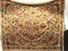 An Arts & Crafts Suzani style linen and cotton running stitch wall hanging, with foliate and leaf