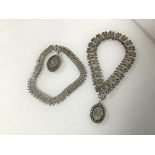 Two Victorian white metal fancy link collars, both with oval shaped lockets, with foliate decoration