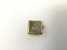 A vintage lady's 18ct gold square wristwatch with silvered dial and arabic numerals, working (2cm