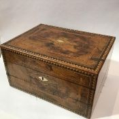 A 19thc walnut boxwood and mother of pearl inlaid writing box with fold out front, top corner