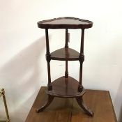 A mahogany whatnot with trefoil dished top on turned supports with middle tier, on tripod