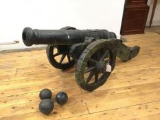 A large cast iron model of a Signalling Canon, the ringed 33" barrel excluding cascabel, mounted