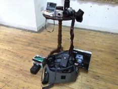 Photography interest: a collection of cameras including Polaroid, the button, Tamron, Fujifilm